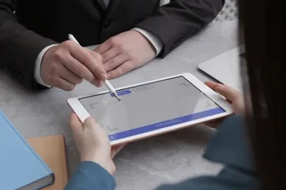 The customer signs on the service’s tablet